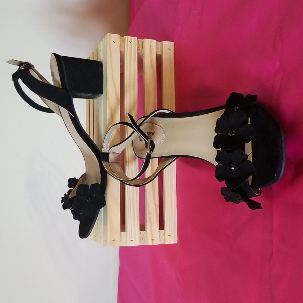 Avon cushion walk black sandals with flower detail.